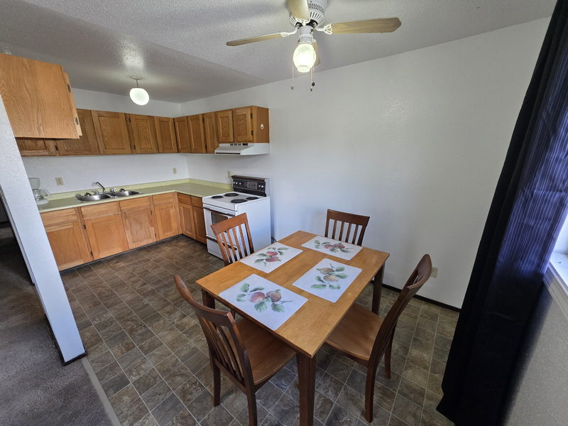 Dining table set beside the kitchen