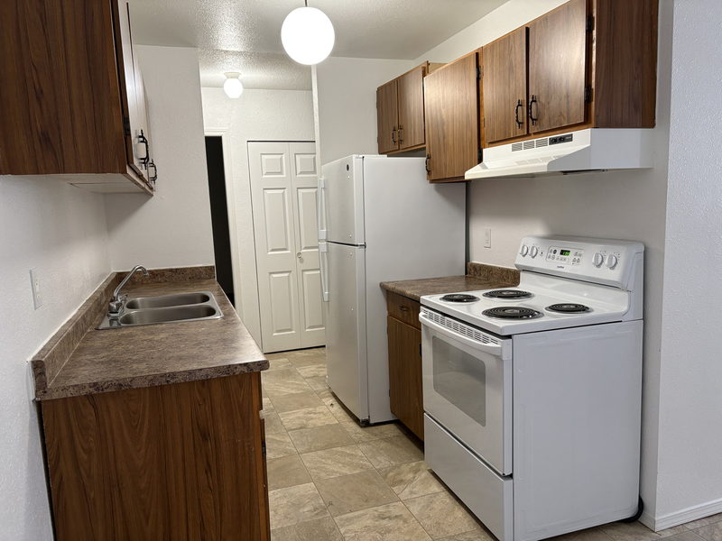 Kitchen with oak cabinets and full-size appliances